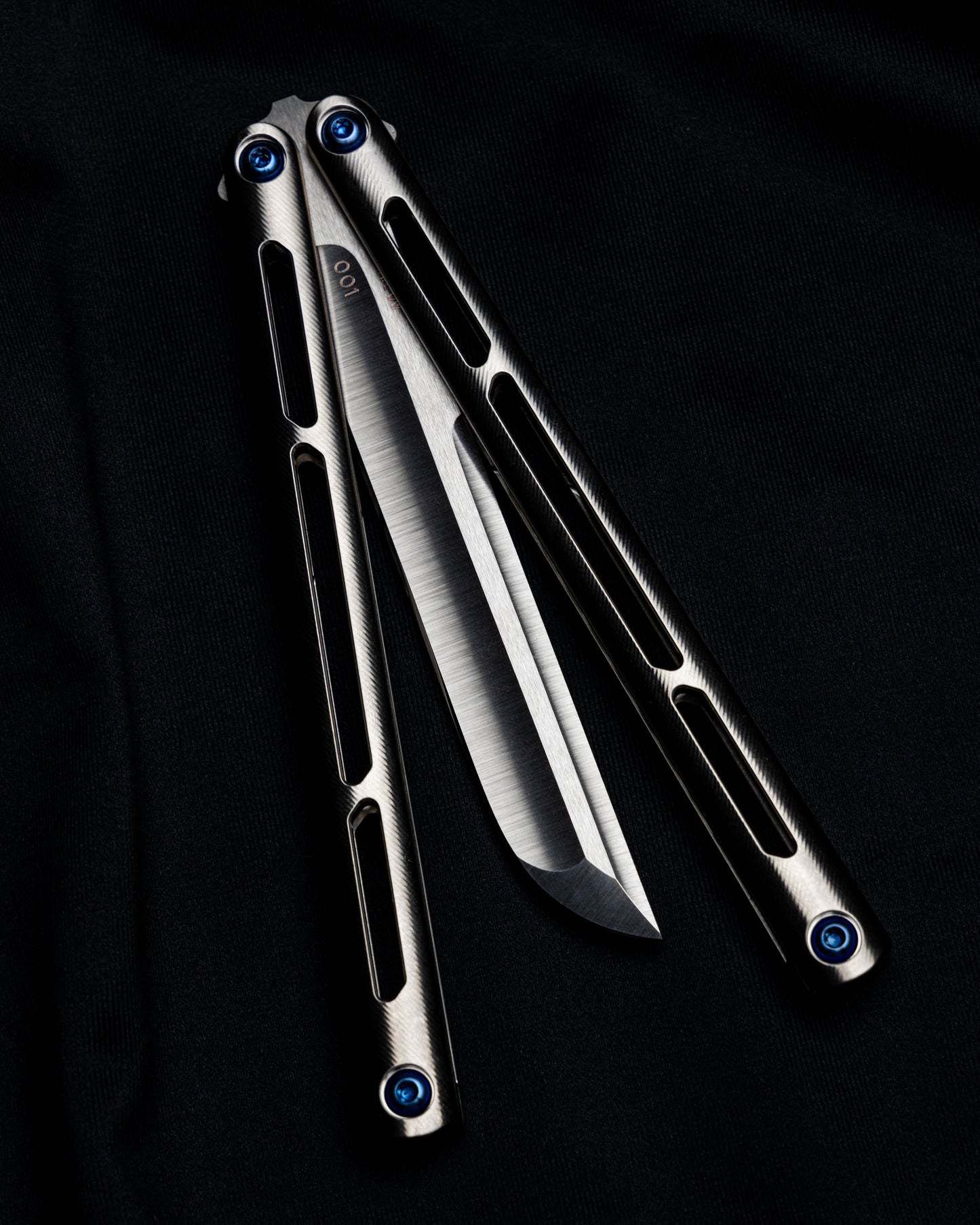 AMKW Satin Tsunami half open on black cloth