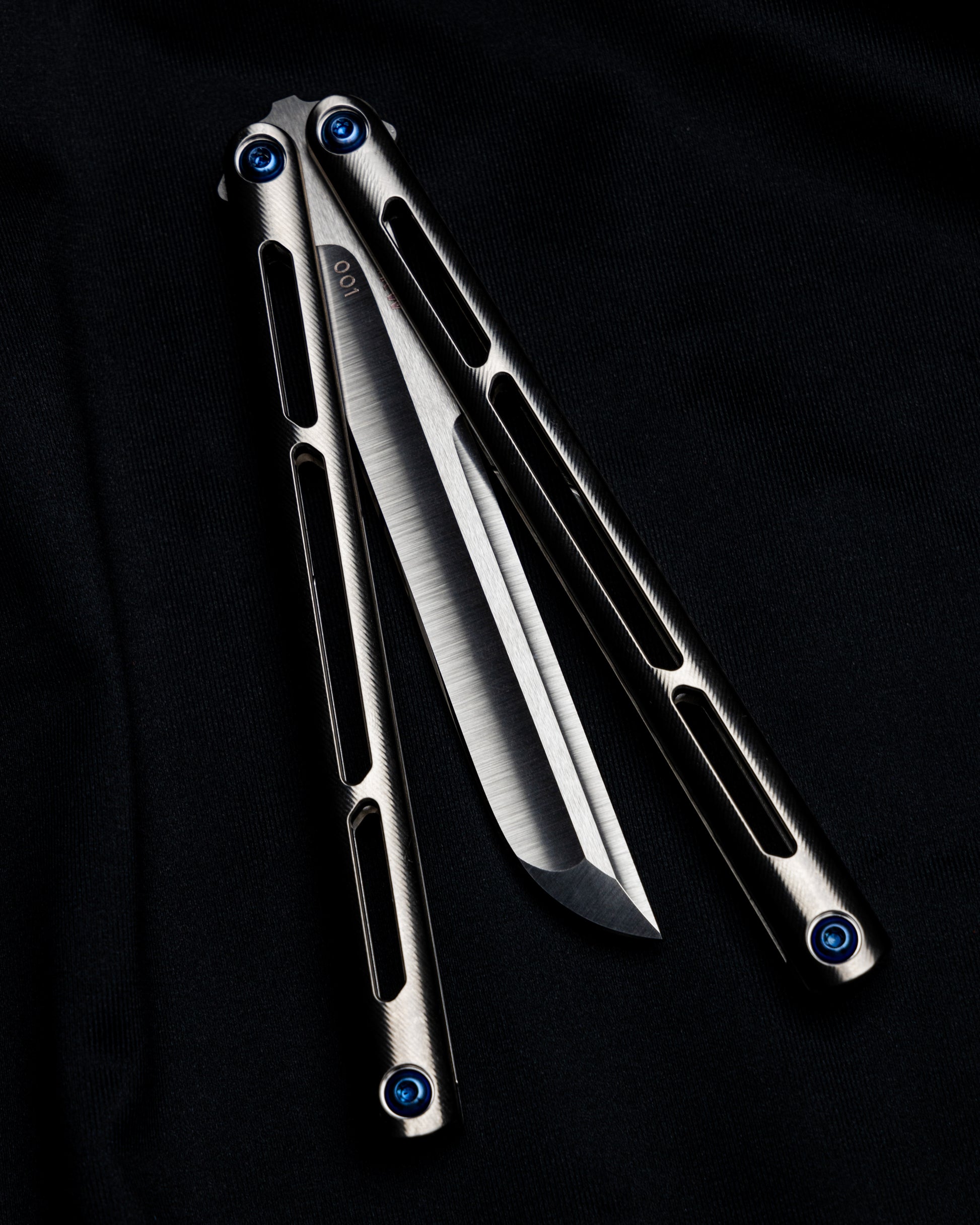 AMKW Satin Tsunami half open on black cloth