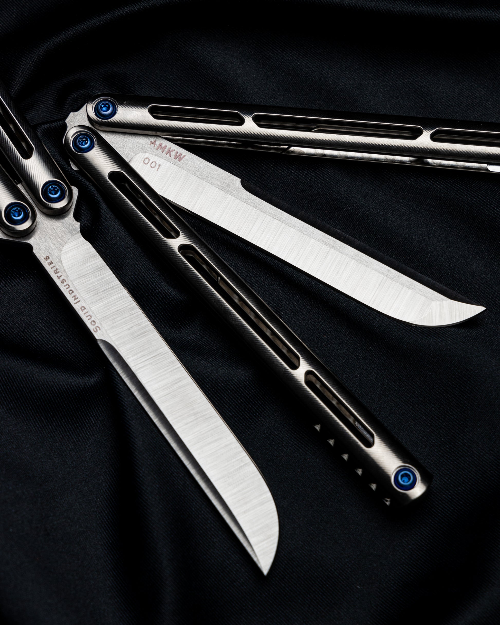 AMKW Satin Tsunami Side By side on black cloth