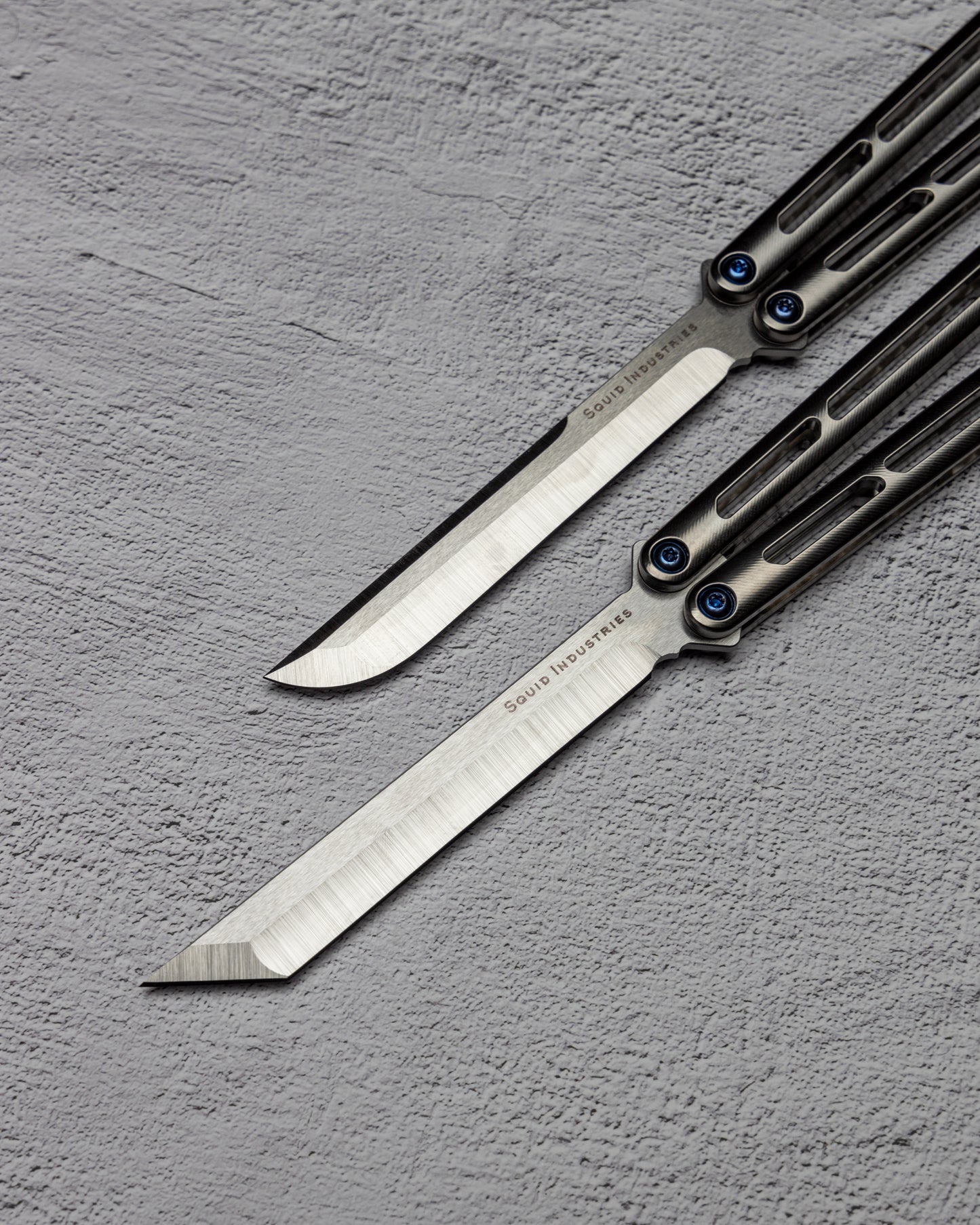 AMKW Tsuami Tanto and Classic Blade on Gray Surface