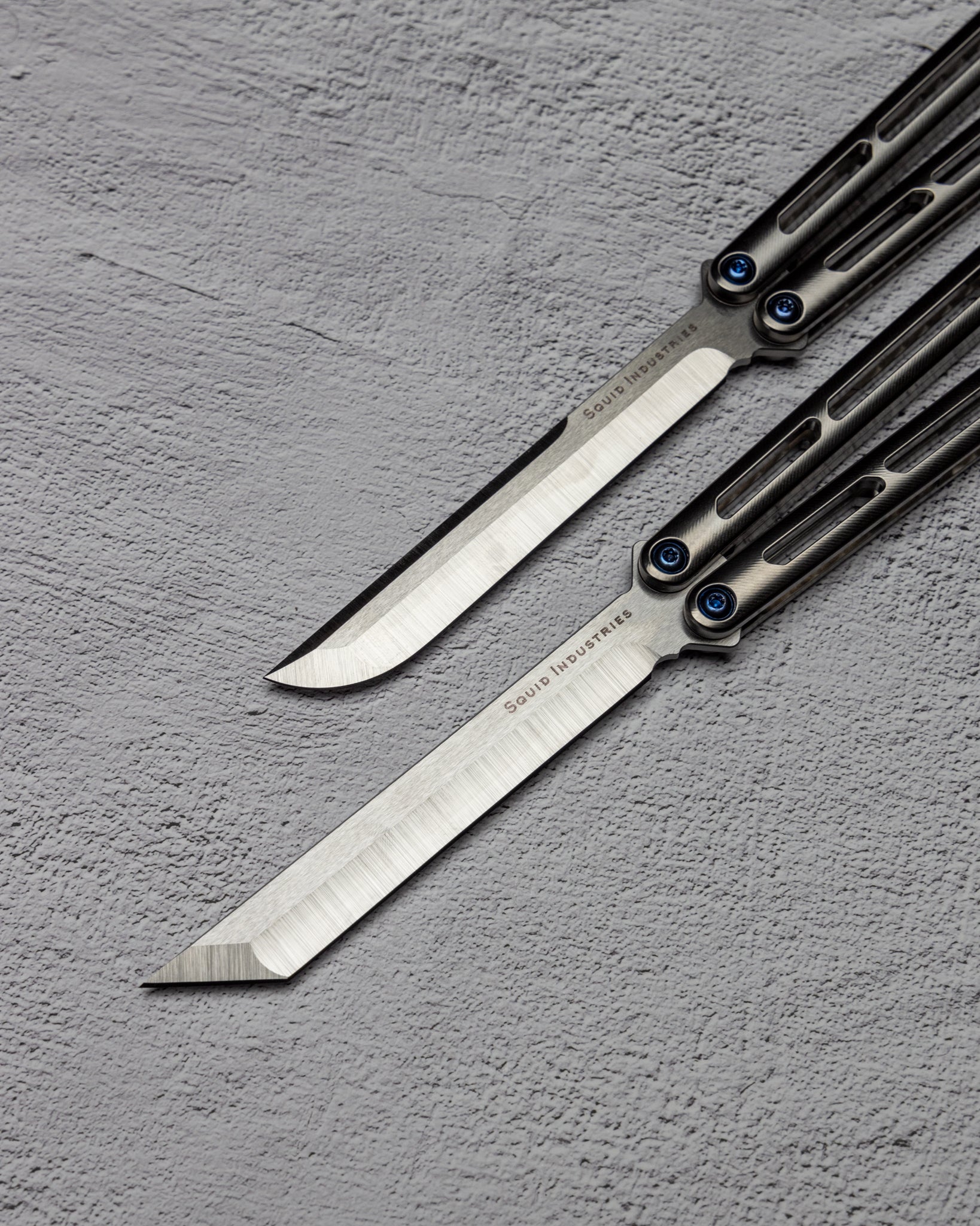 AMKW Tsuami Tanto and Classic Blade on Gray Surface