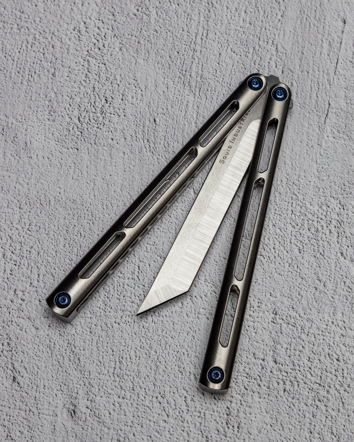 AMKW Tsunami Tanto Half Open on Gray Surface