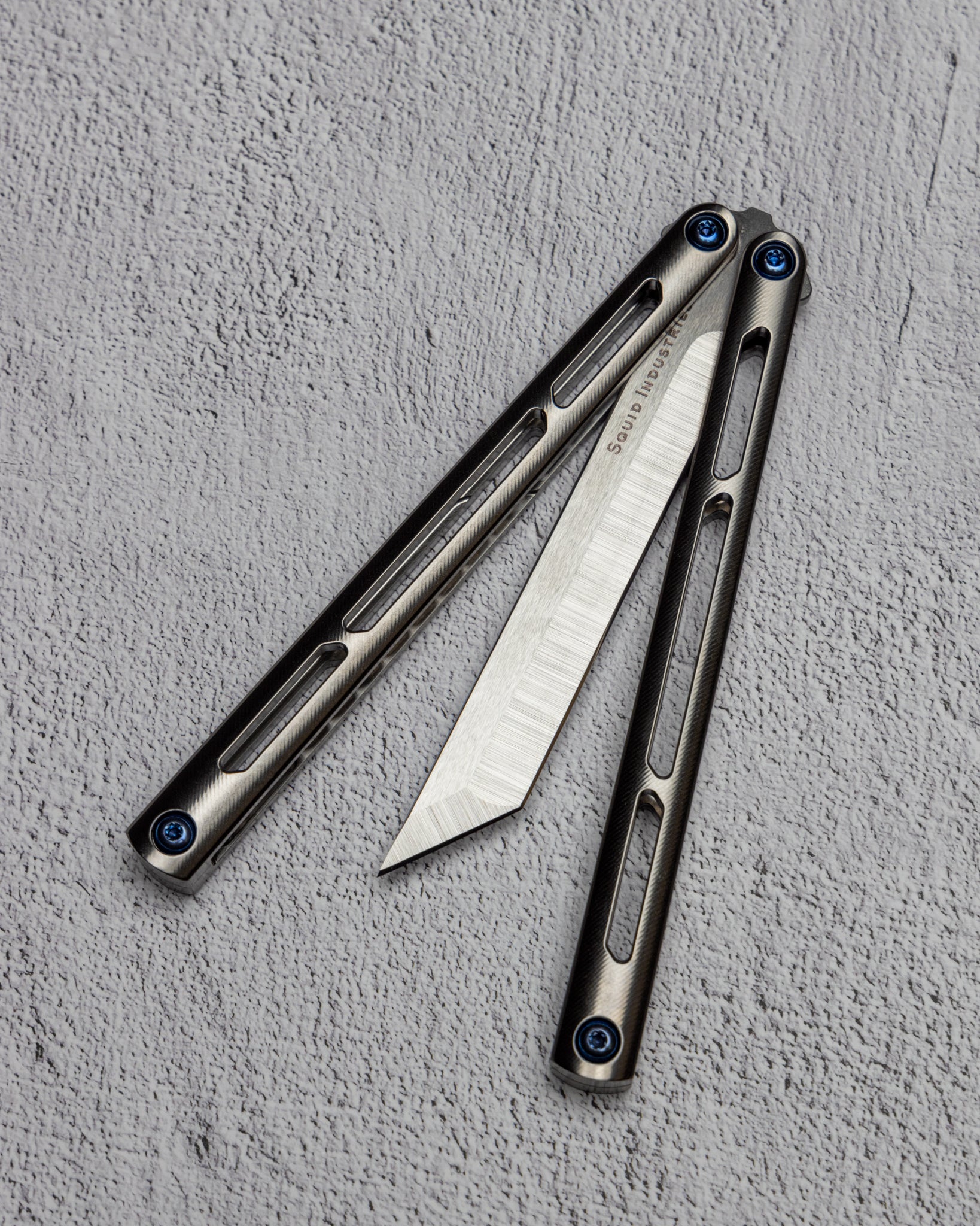 AMKW Tsunami Tanto Half Open on Gray Surface
