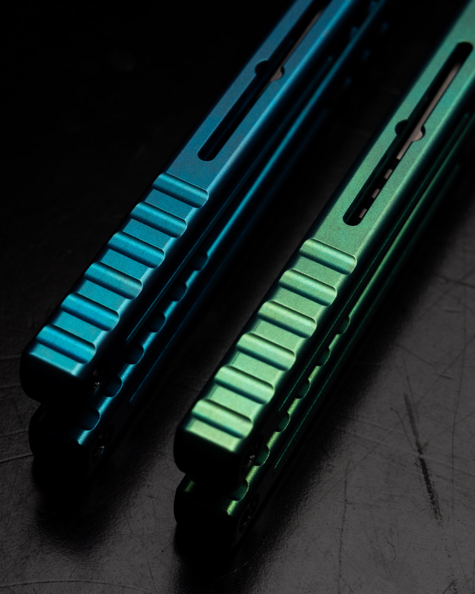 Anodized Madko Tanto Handle Close Up Side By Side Black Background