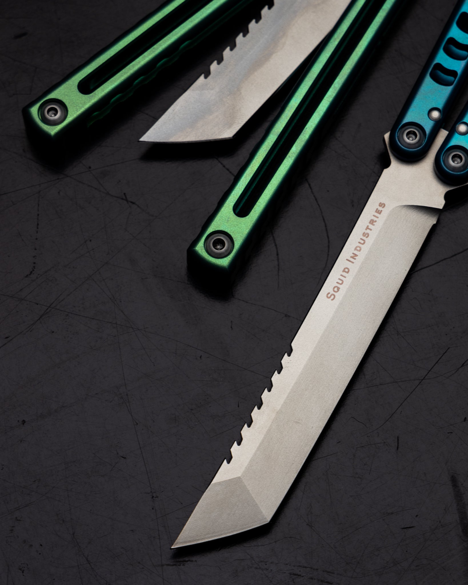 Anodized Madko Tanto Handle Close Up Side By Side Black Background