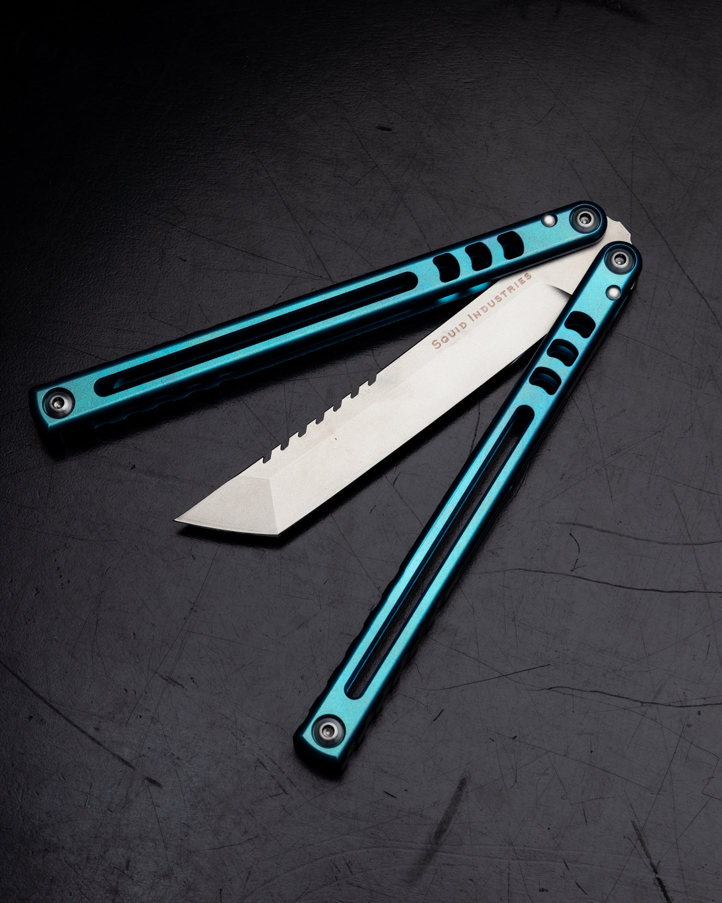 Anodized Teal Madko Tanto Semi Closed Black Background