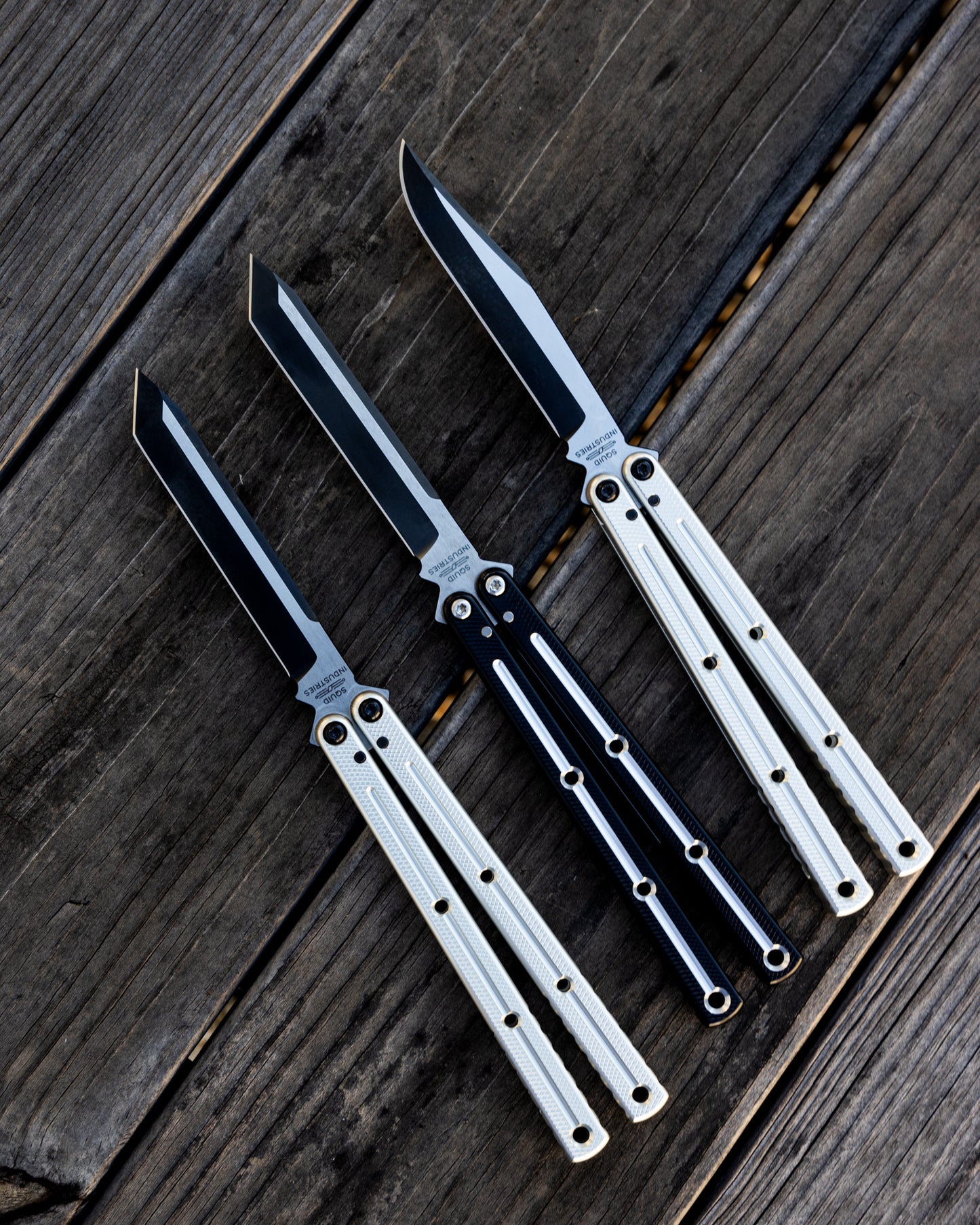 Tanto Silver, Tanto DT Black, Bowie Silver on wooden table