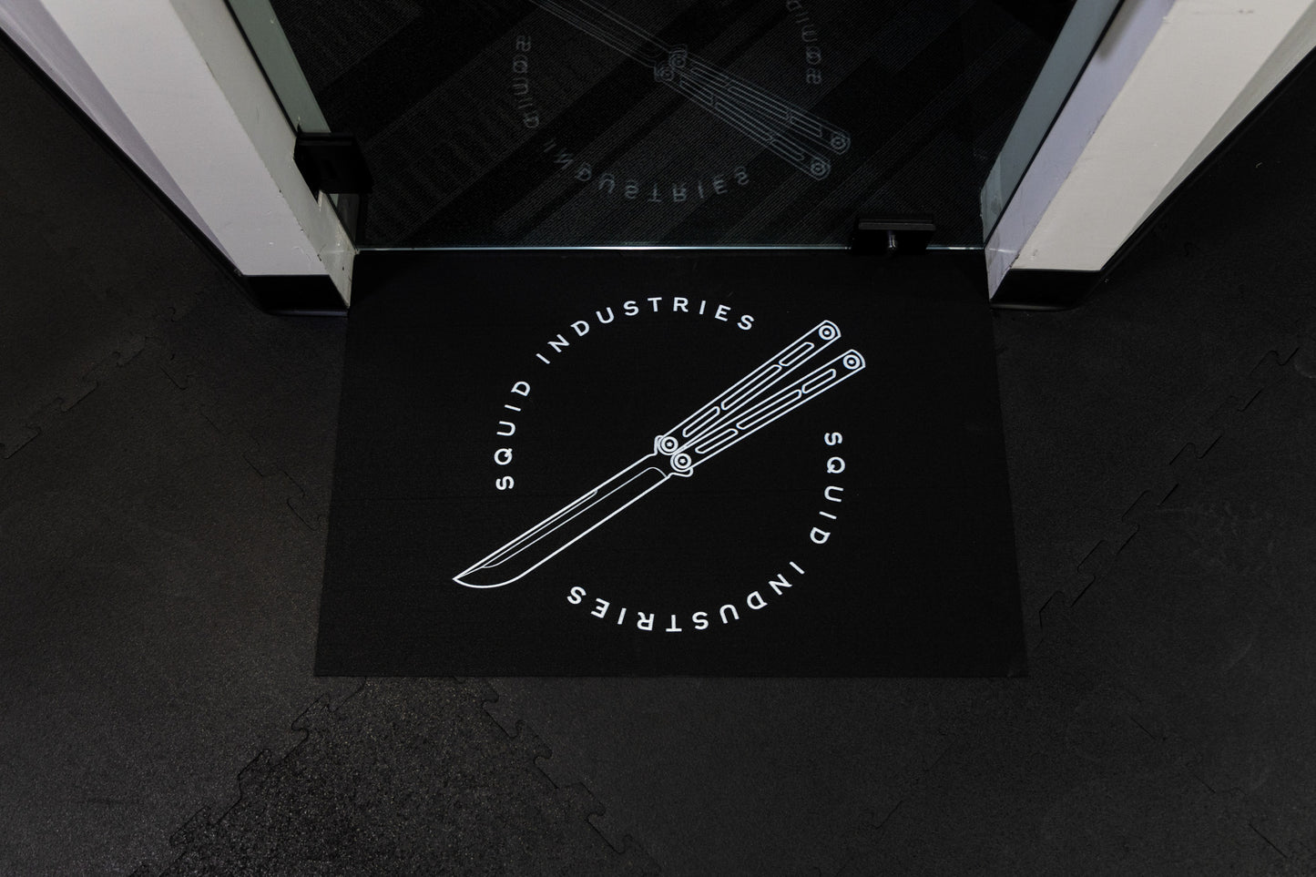 Flipping mat infront of a glass door