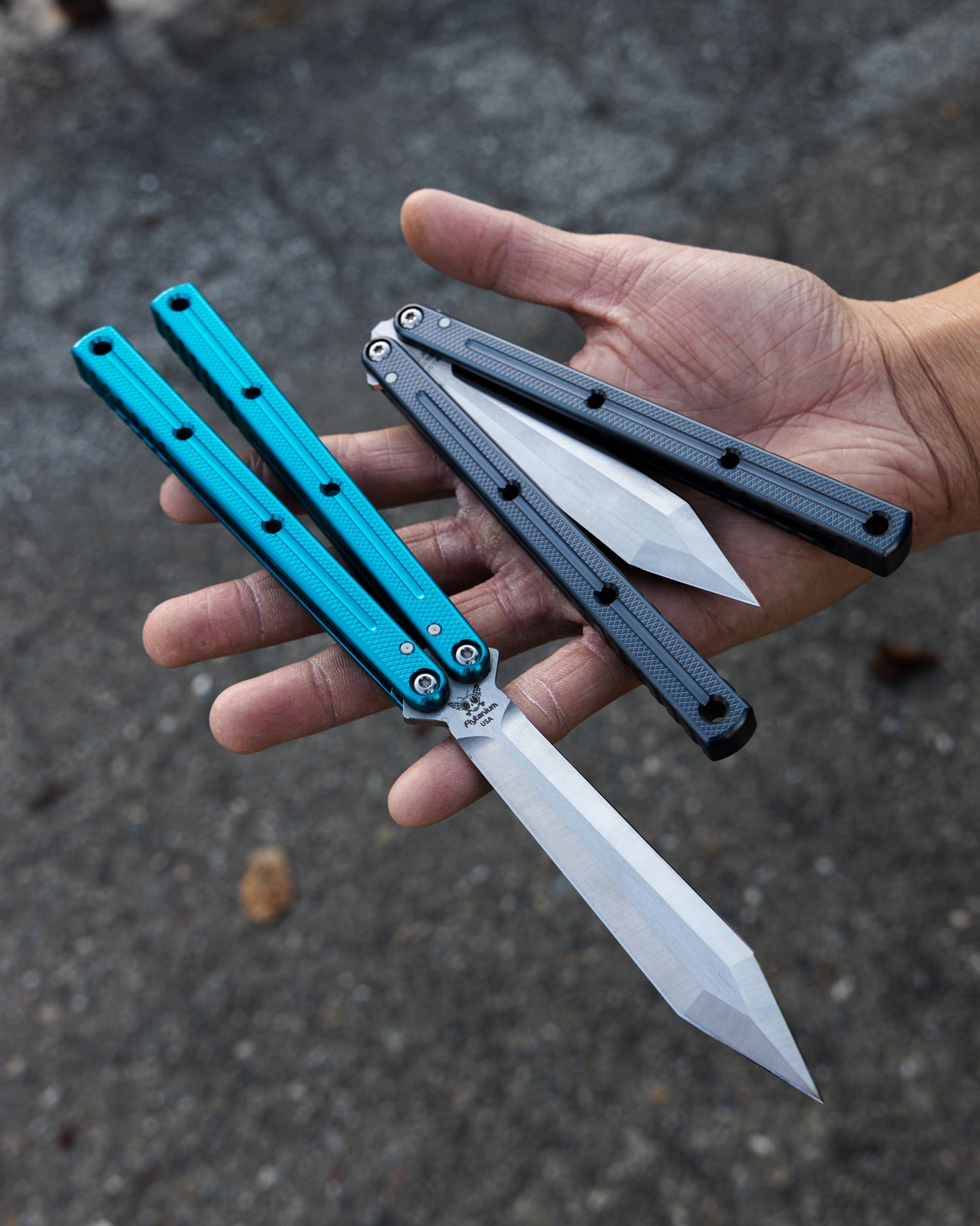 Teal and Gunmetal Flytanium Krake Raken On Hand